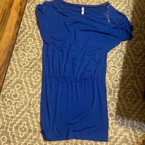 Blue dress, tight at bottom and flowing up top.